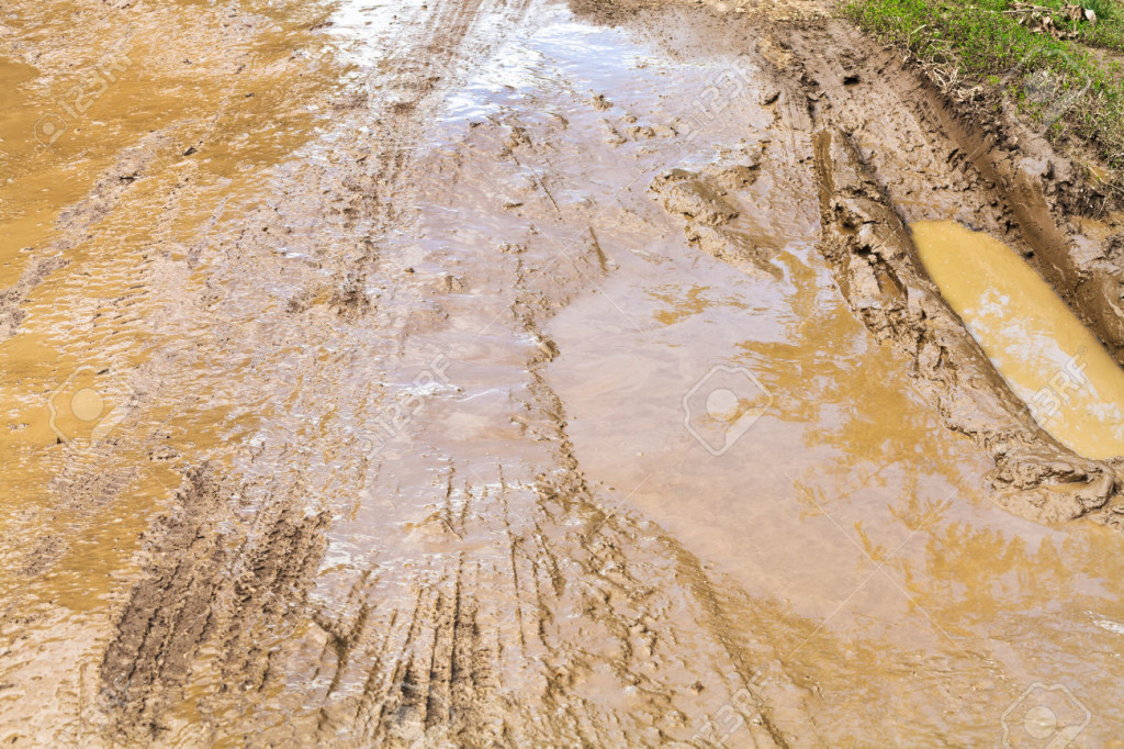 mud and puddle at dirt road
